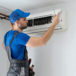 professional technician installing a new AC unit