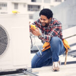 Technician repair an AC unit